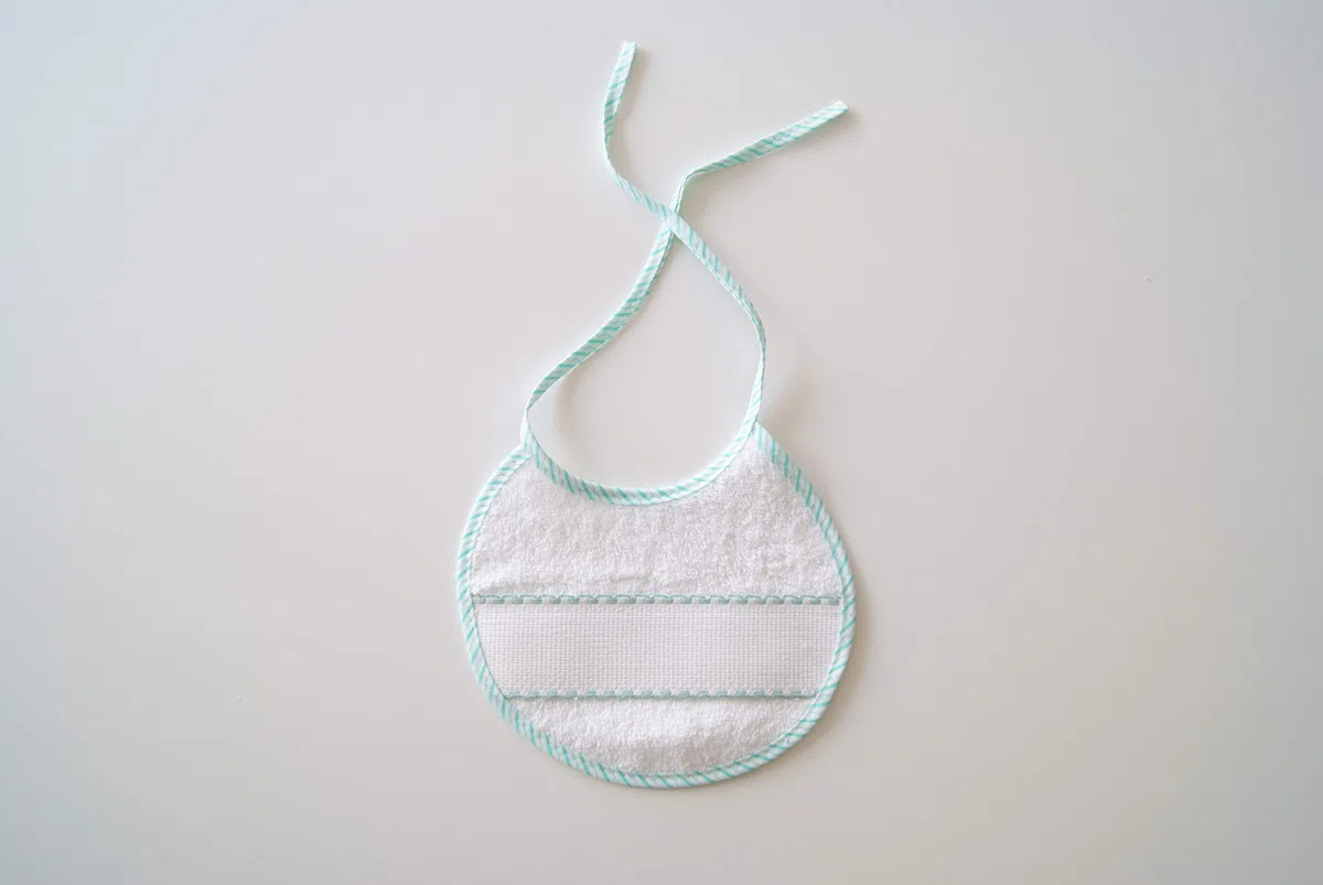Interbaby 00040 - Pack de 12 baberos de punto de cruz 20x20, unisex